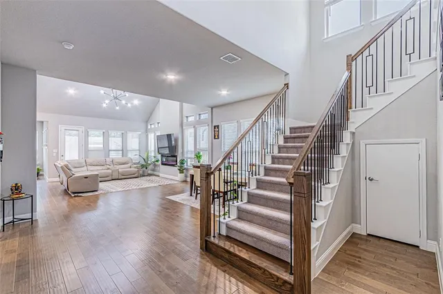 a view of entryway and hall with wooden floor