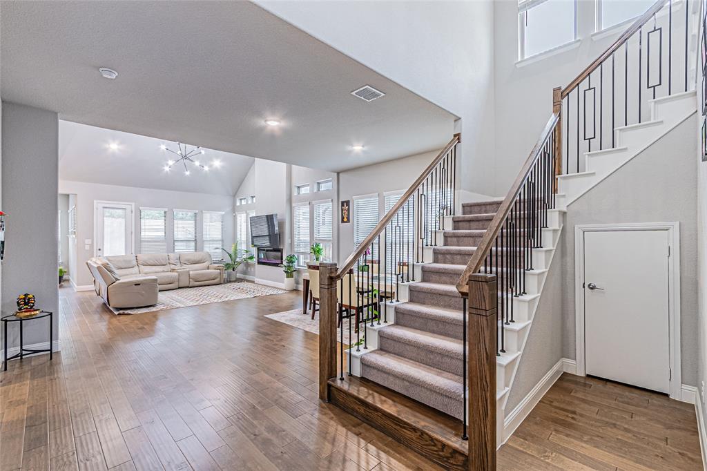 13261 Jonata Street Frisco, TX 75035 - Photo 7 of 40 a view of entryway and hall with wooden floor