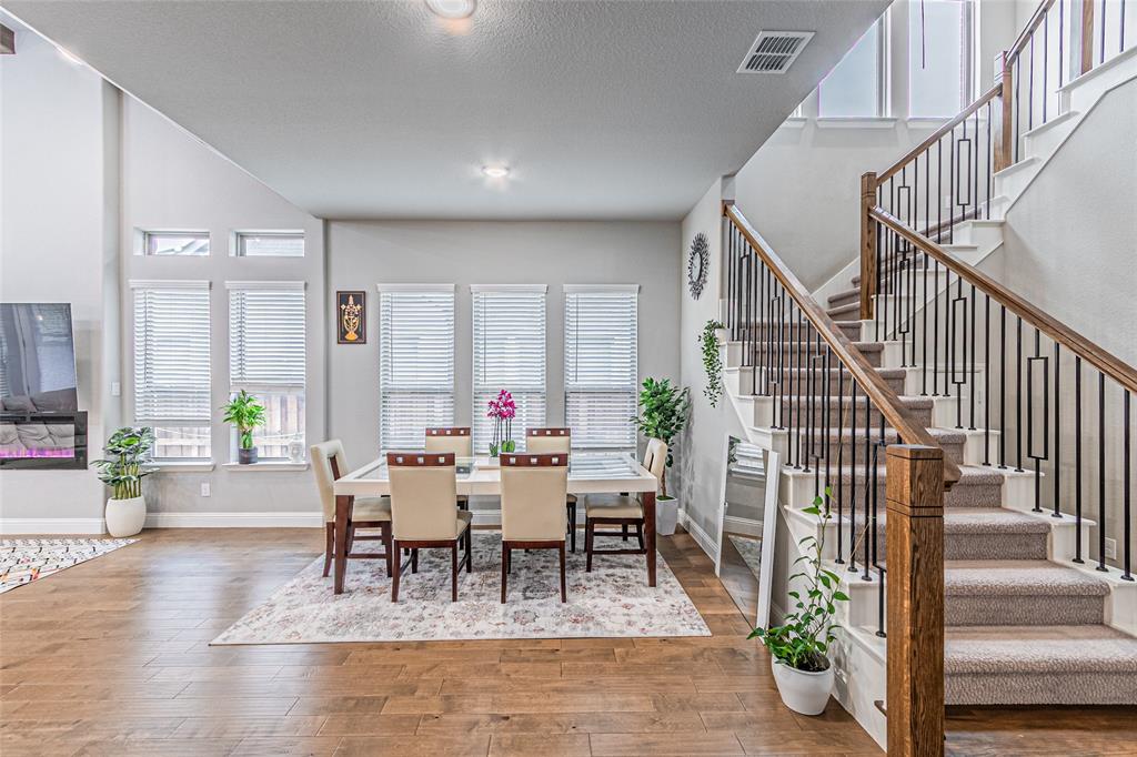 13261 Jonata Street Frisco, TX 75035 - Photo 8 of 40 a view of a dining room with furniture window and wooden floor