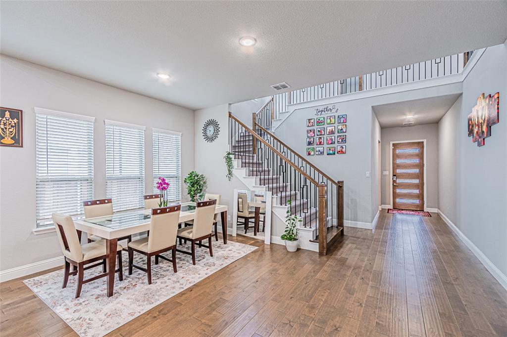 13261 Jonata Street Frisco, TX 75035 - Photo 9 of 40 a view of a dining room with furniture and wooden floor