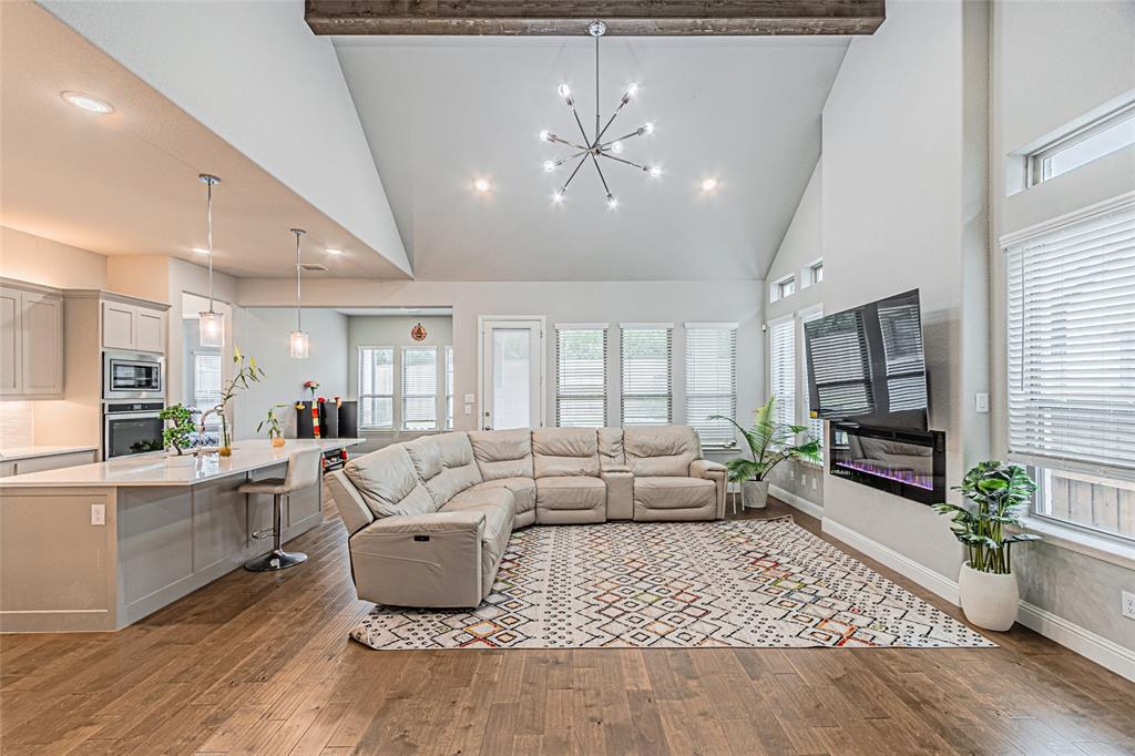 13261 Jonata Street Frisco, TX 75035 - Photo 10 of 40 a living room with furniture and a flat screen tv
