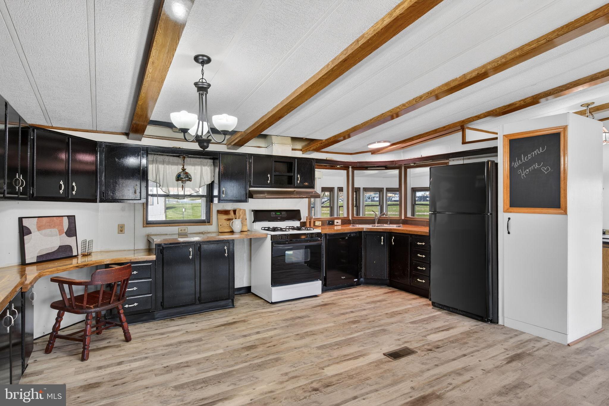 918 Krista Court Lancaster, PA 17601 - Photo 12 of 43 a kitchen with stainless steel appliances kitchen island granite countertop a stove refrigerator and cabinets