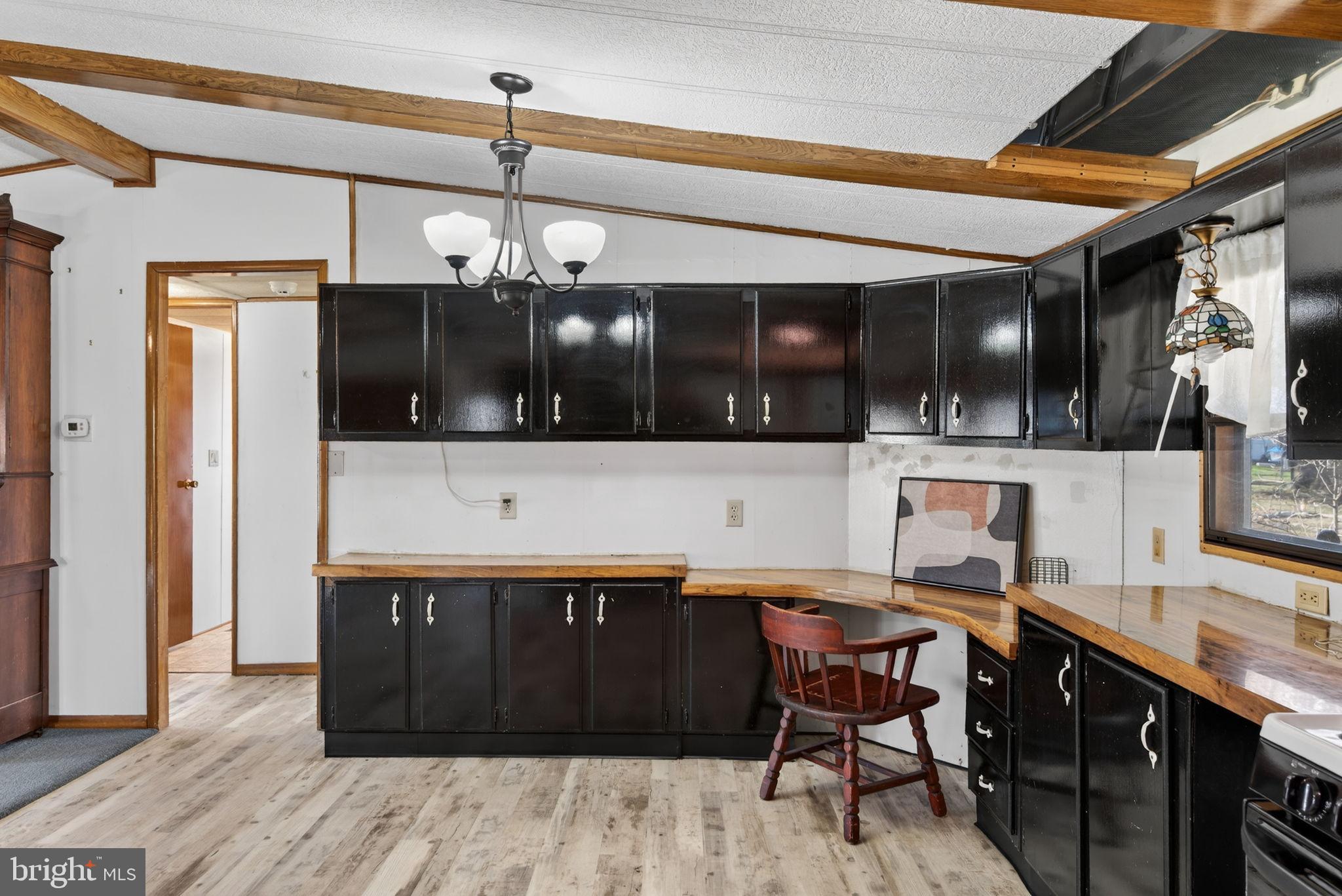 918 Krista Court Lancaster, PA 17601 - Photo 14 of 43 a kitchen with stainless steel appliances wooden cabinets and a stove top oven