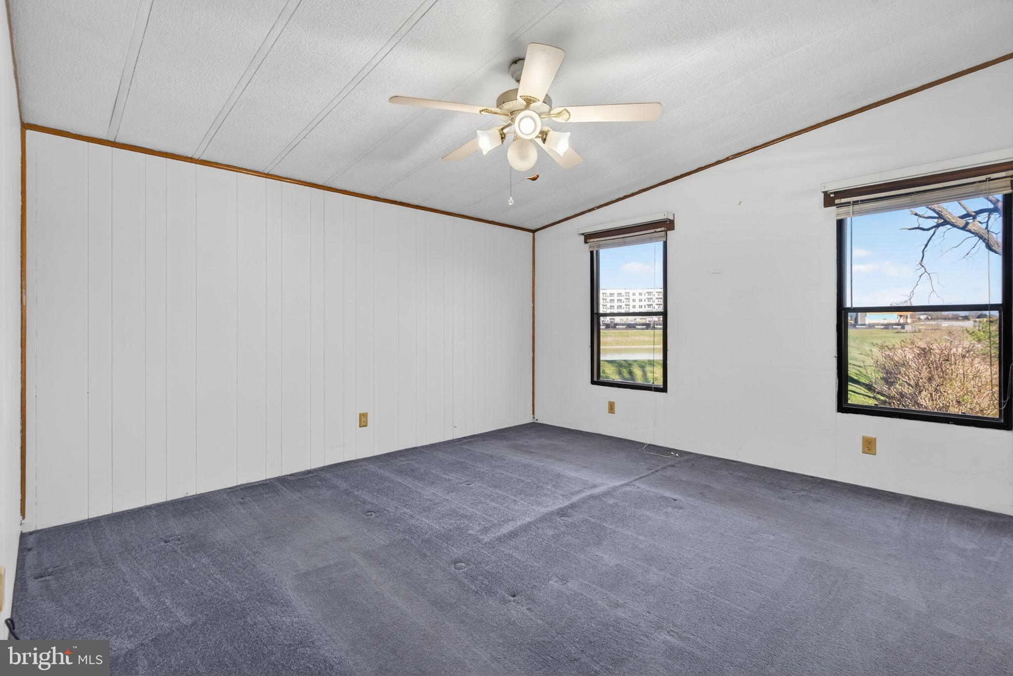918 Krista Court Lancaster, PA 17601 - Photo 18 of 43 an empty room with chandelier fan and windows