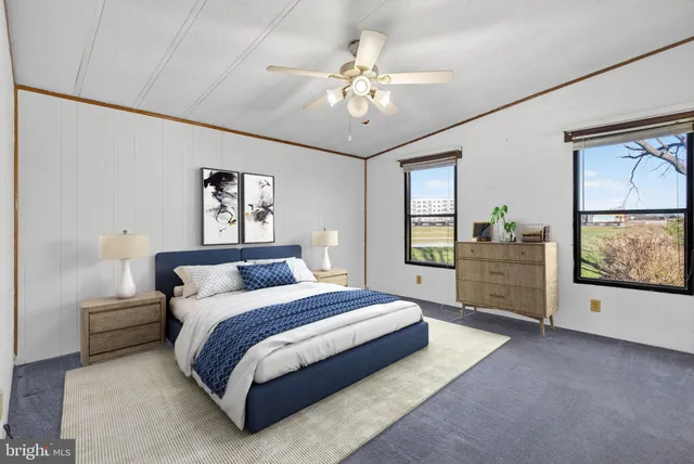 a utility room with cabinets washer and dryer