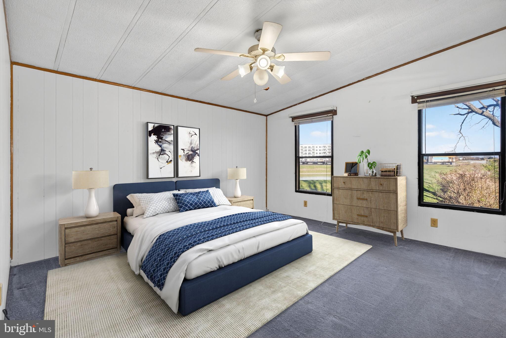 918 Krista Court Lancaster, PA 17601 - Photo 19 of 43 a spacious bedroom with a large bed and a chandelier