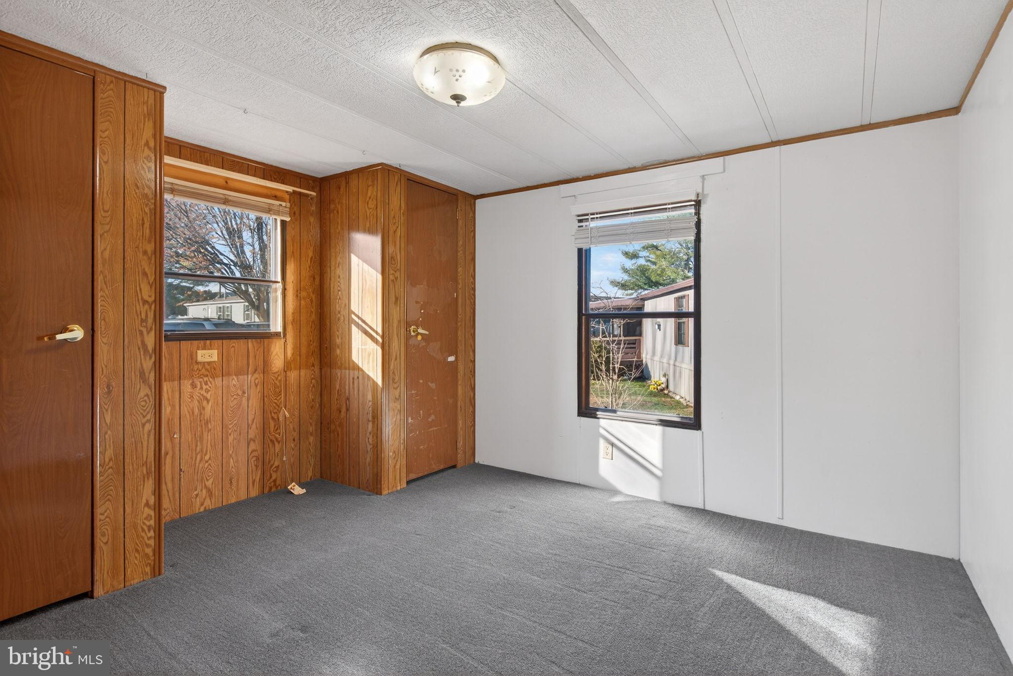 918 Krista Court Lancaster, PA 17601 - Photo 24 of 43 an empty room with windows closet and chandelier fan