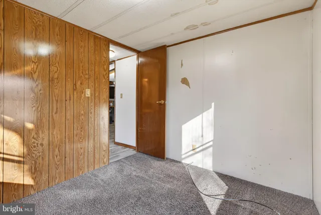 a view of a lake with houses in the back