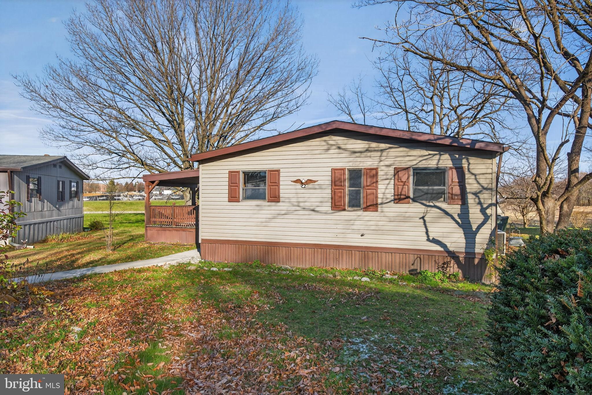 918 Krista Court Lancaster, PA 17601 - Photo 3 of 43 a front view of a house with a yard and trees
