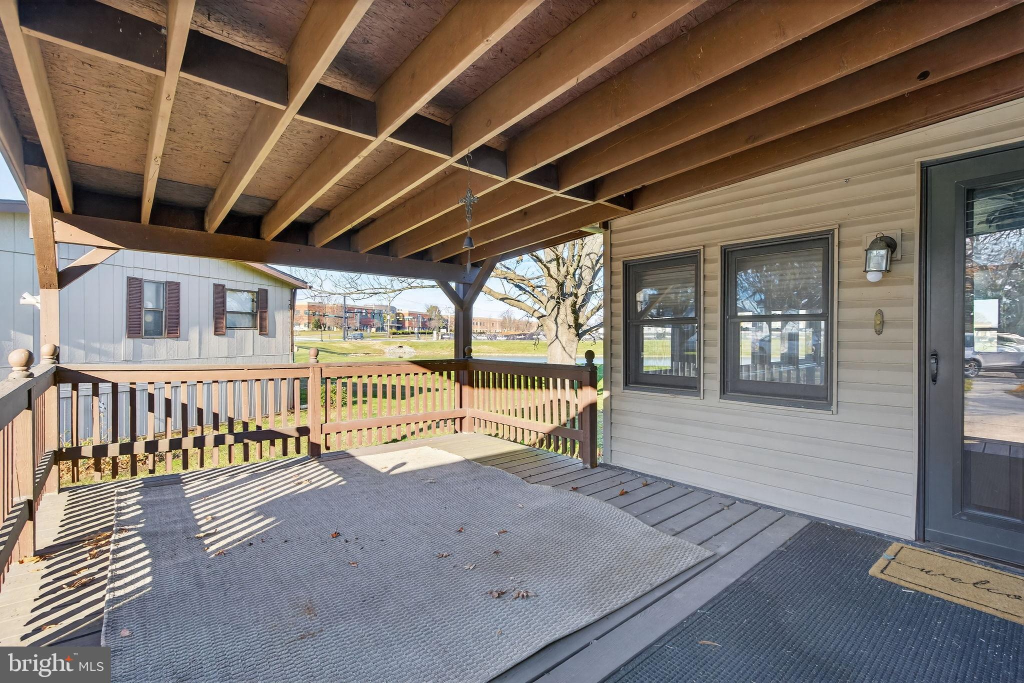 918 Krista Court Lancaster, PA 17601 - Photo 4 of 43 a view of a porch with wooden floor and fence