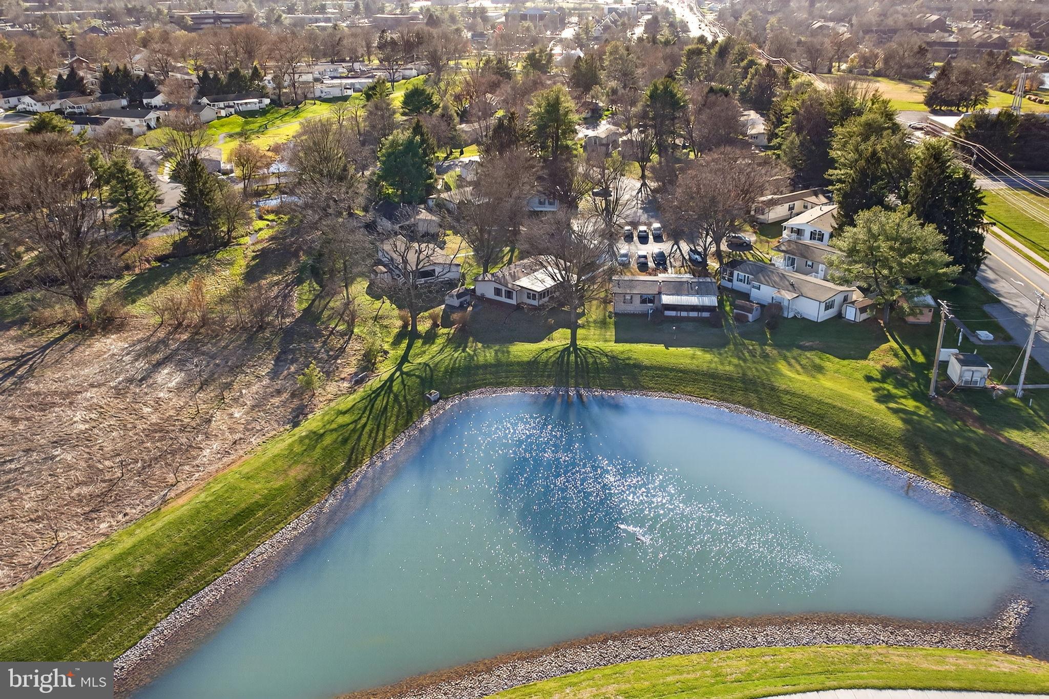 918 Krista Court Lancaster, PA 17601 - Photo 41 of 43 a view of a lake with a yard and mountain view
