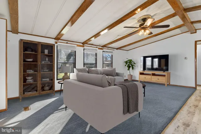 a kitchen with stainless steel appliances kitchen island granite countertop a stove refrigerator and cabinets