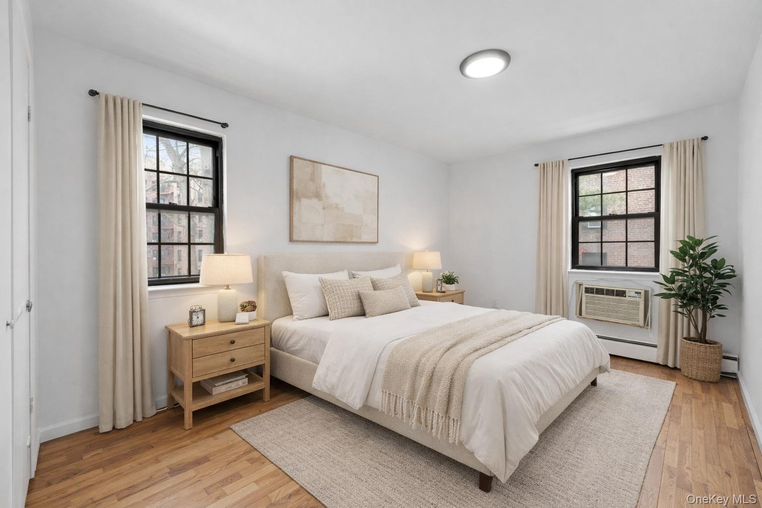 84-30 98th Street Queens, NY 11421 - Photo 17 of 35 a bedroom with a large bed and a window