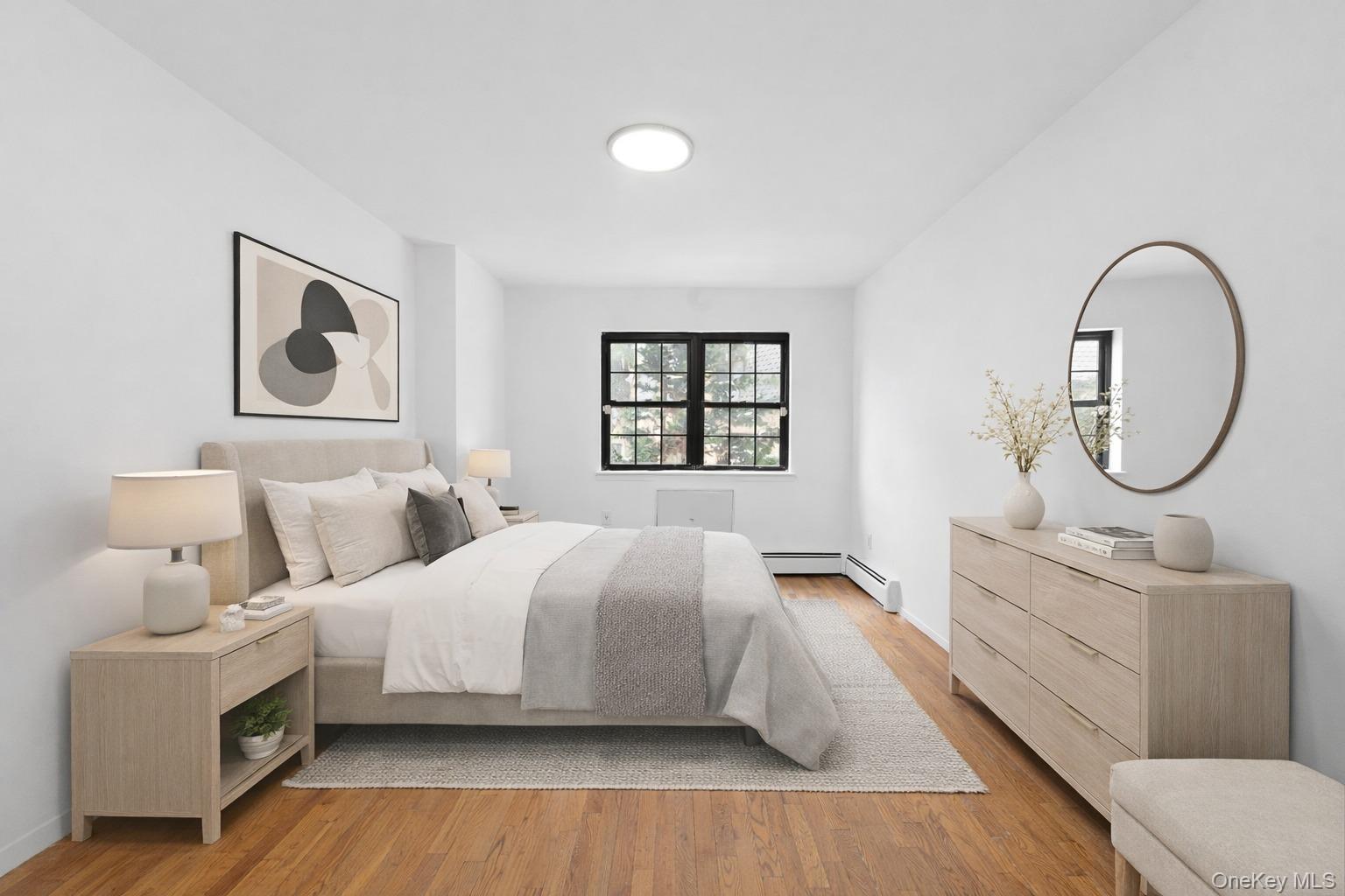 84-30 98th Street Queens, NY 11421 - Photo 25 of 35 a bedroom with a large bed and a large window