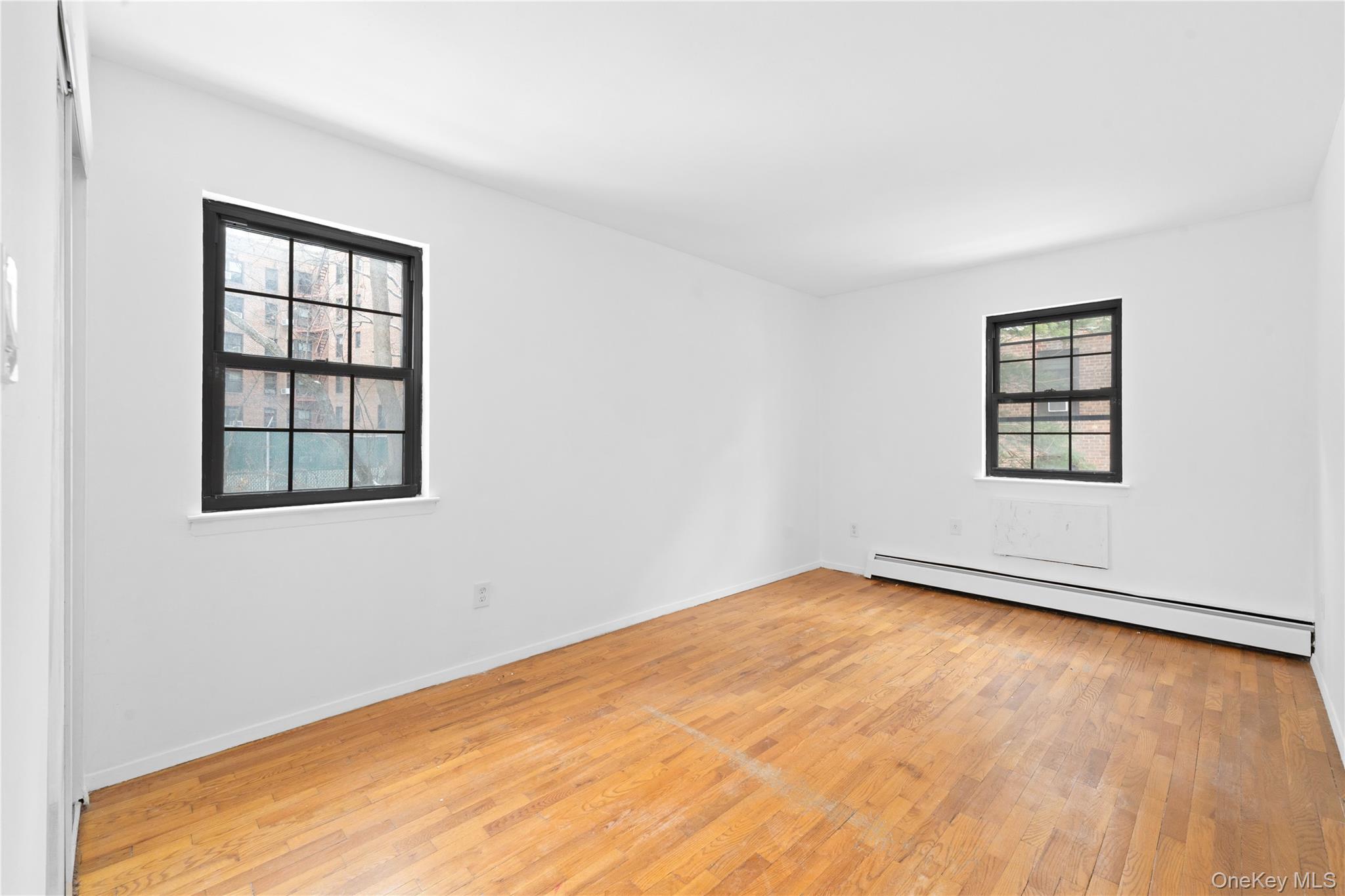 84-30 98th Street Queens, NY 11421 - Photo 26 of 35 an empty room with a window