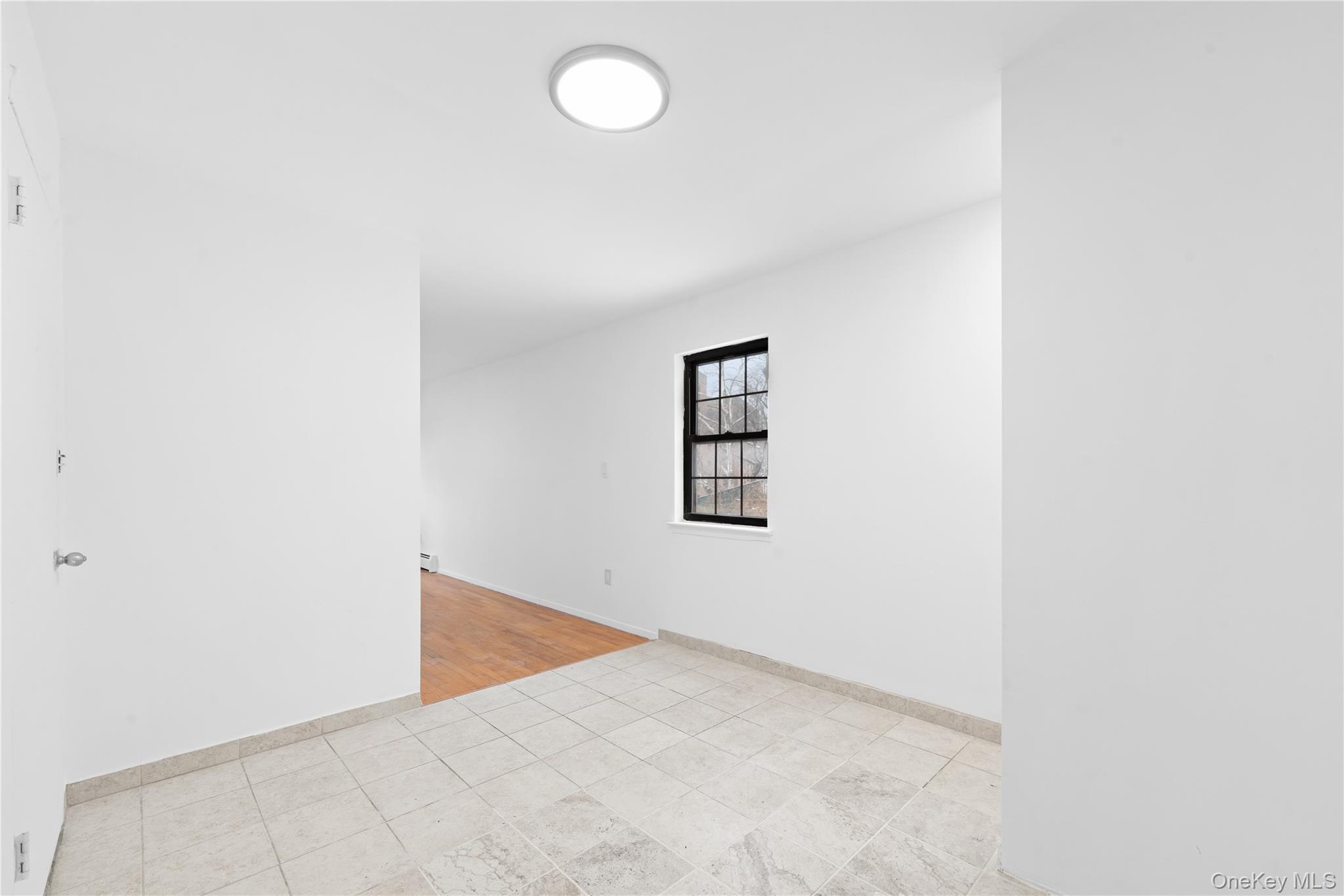 84-30 98th Street Queens, NY 11421 - Photo 28 of 35 a view of a room with a fan