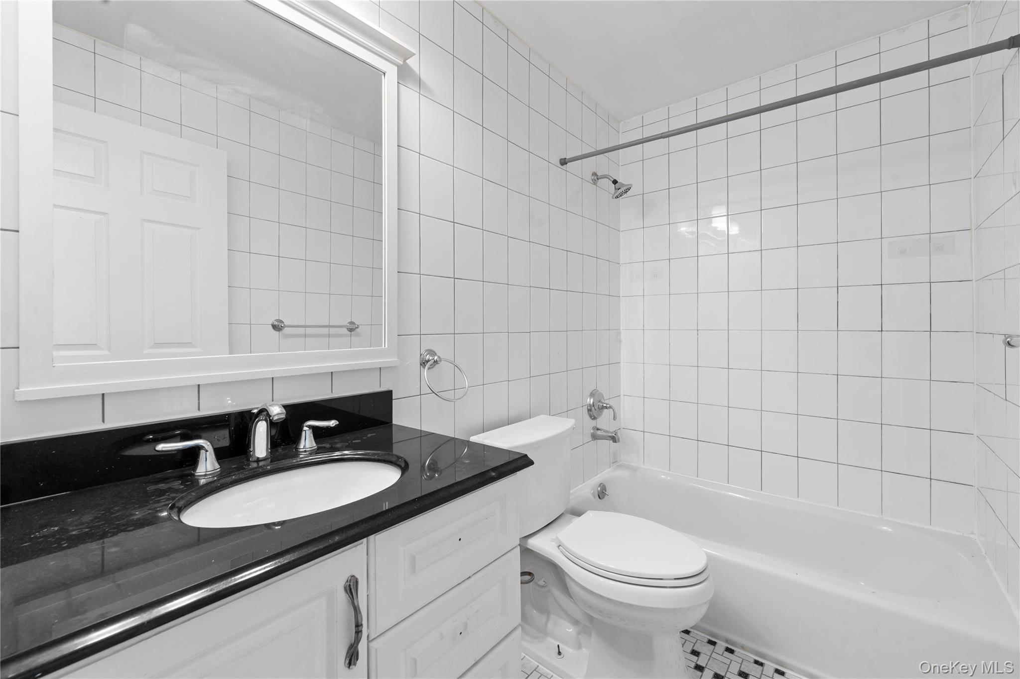 84-30 98th Street Queens, NY 11421 - Photo 32 of 35 a bathroom with a sink and a toilet