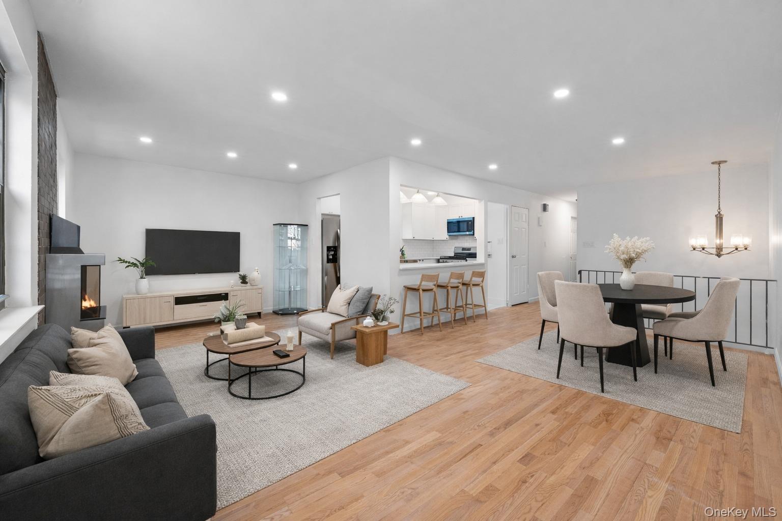 84-30 98th Street Queens, NY 11421 - Photo 7 of 35 a living room with furniture kitchen view and a flat screen tv