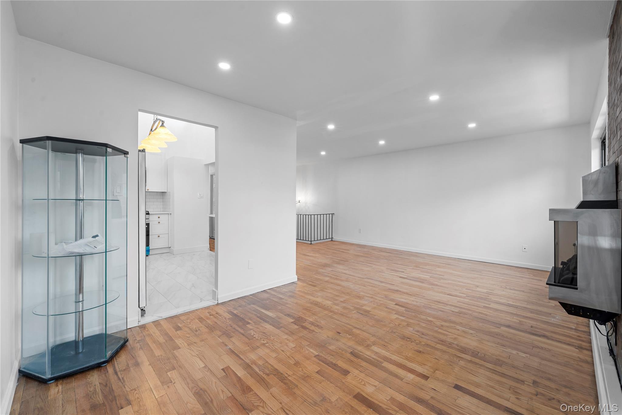 84-30 98th Street Queens, NY 11421 - Photo 8 of 35 a view of empty room with wooden floor and window