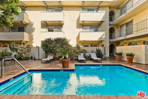 an aerial view of a house with swimming pool
