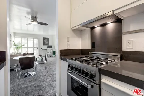 a kitchen with a stove and a refrigerator