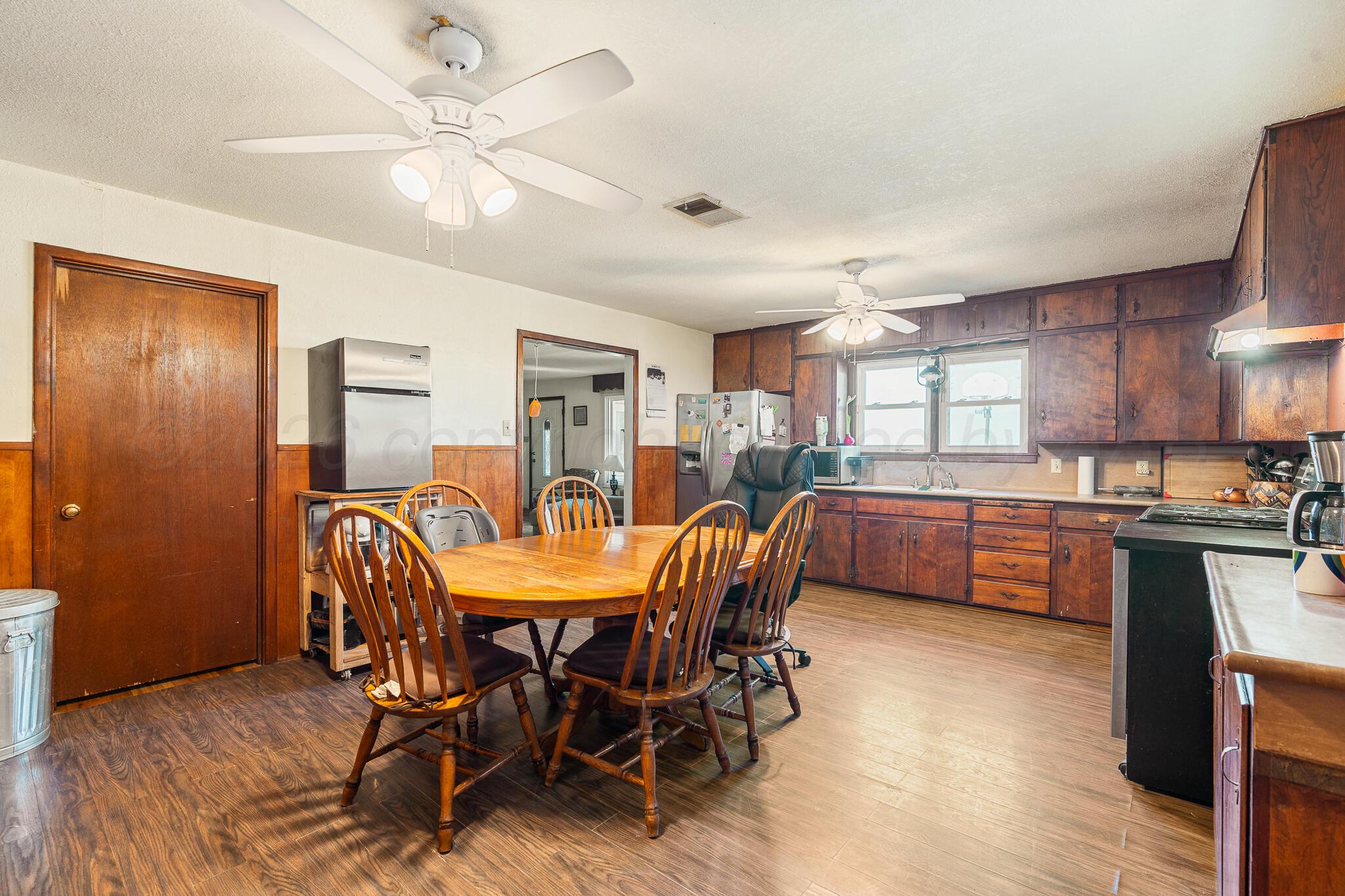 1790 Farm To Market Road 145 Hart, TX 79043 - Photo 18 of 28 a view of a dining room with furniture and a chandelier