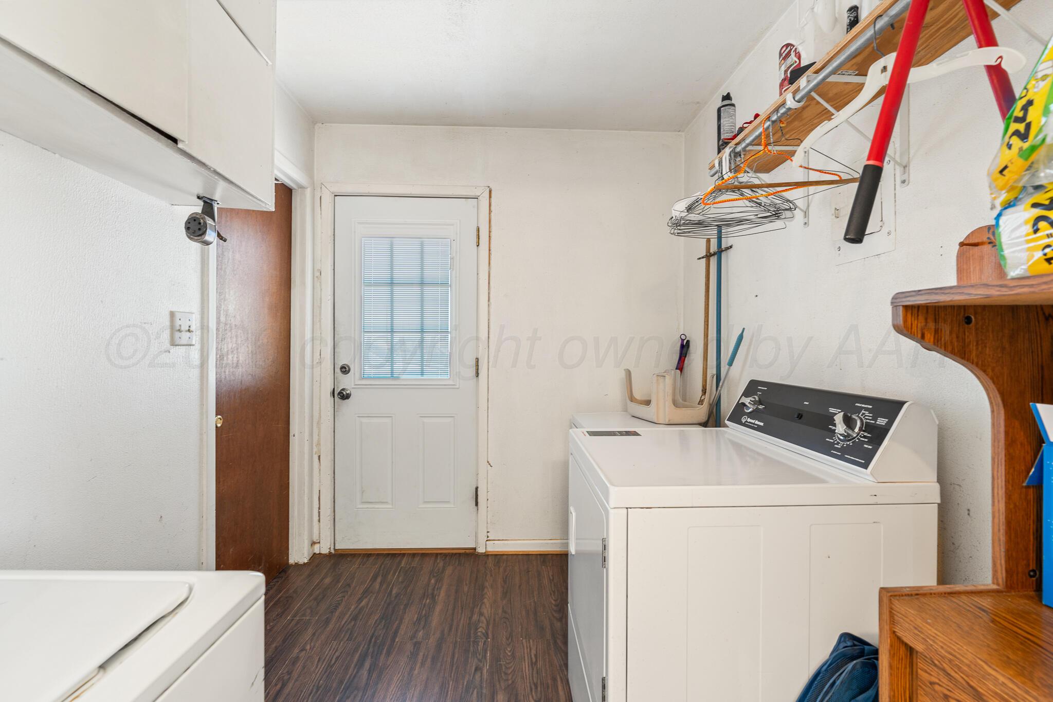 1790 Farm To Market Road 145 Hart, TX 79043 - Photo 23 of 28 a view of storage and utility room with washer and dryer