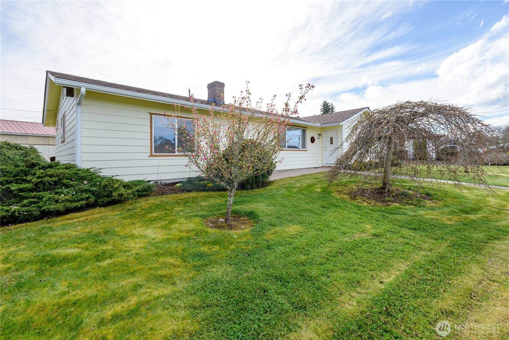 343 West Hemlock Street Sequim, WA 98382 - Photo 2 of 16 a house view with a garden space