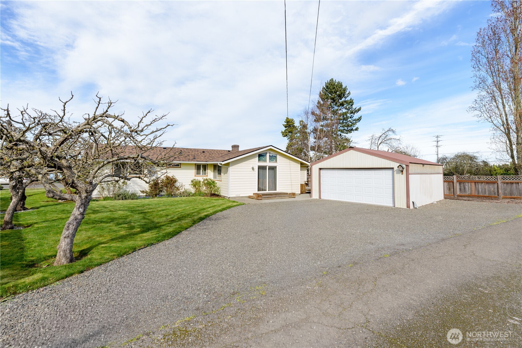 343 West Hemlock Street Sequim, WA 98382 - Photo 3 of 16 a front view of a house with a yard and garage