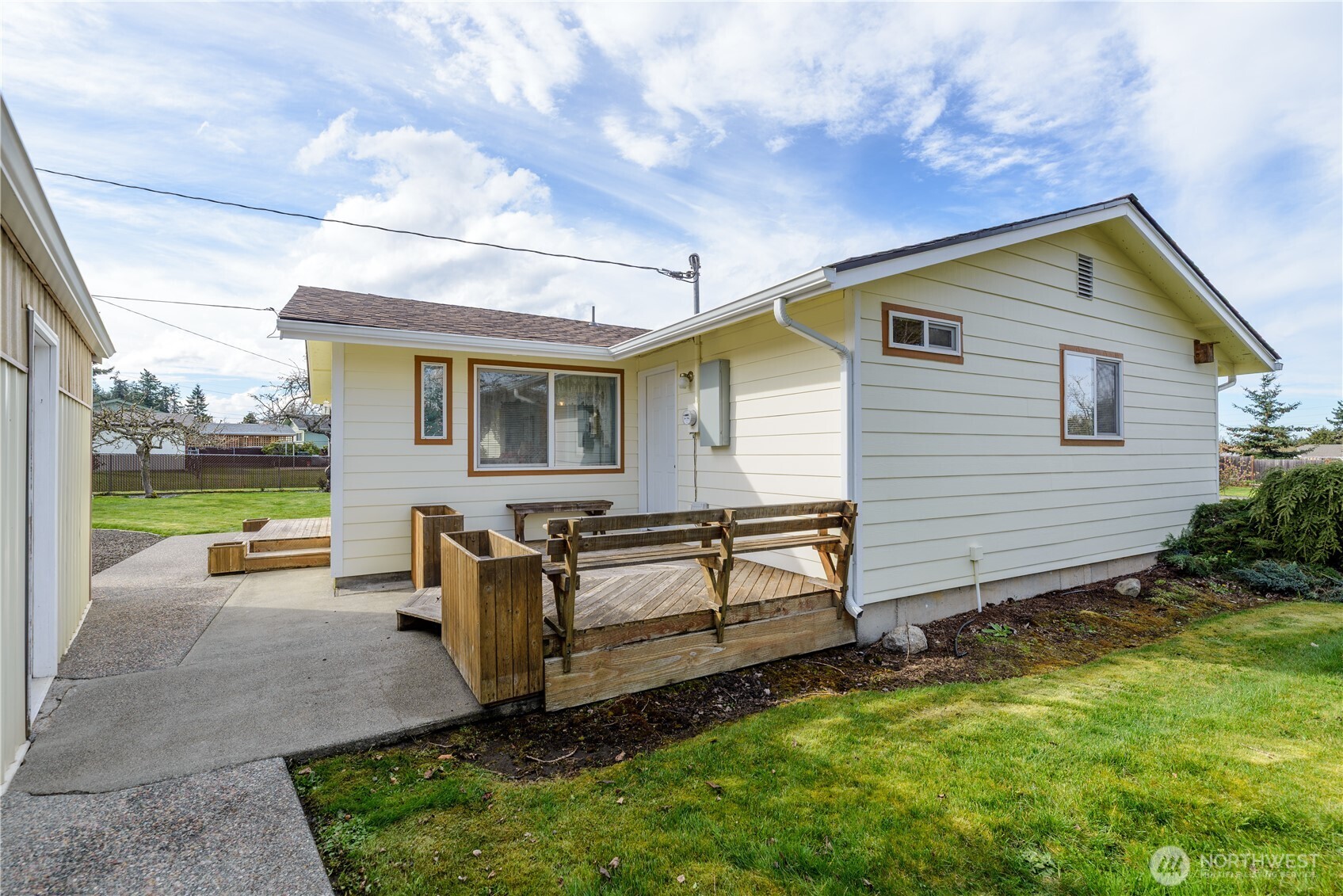 343 West Hemlock Street Sequim, WA 98382 - Photo 4 of 16 a view of a backyard with plants and a garden