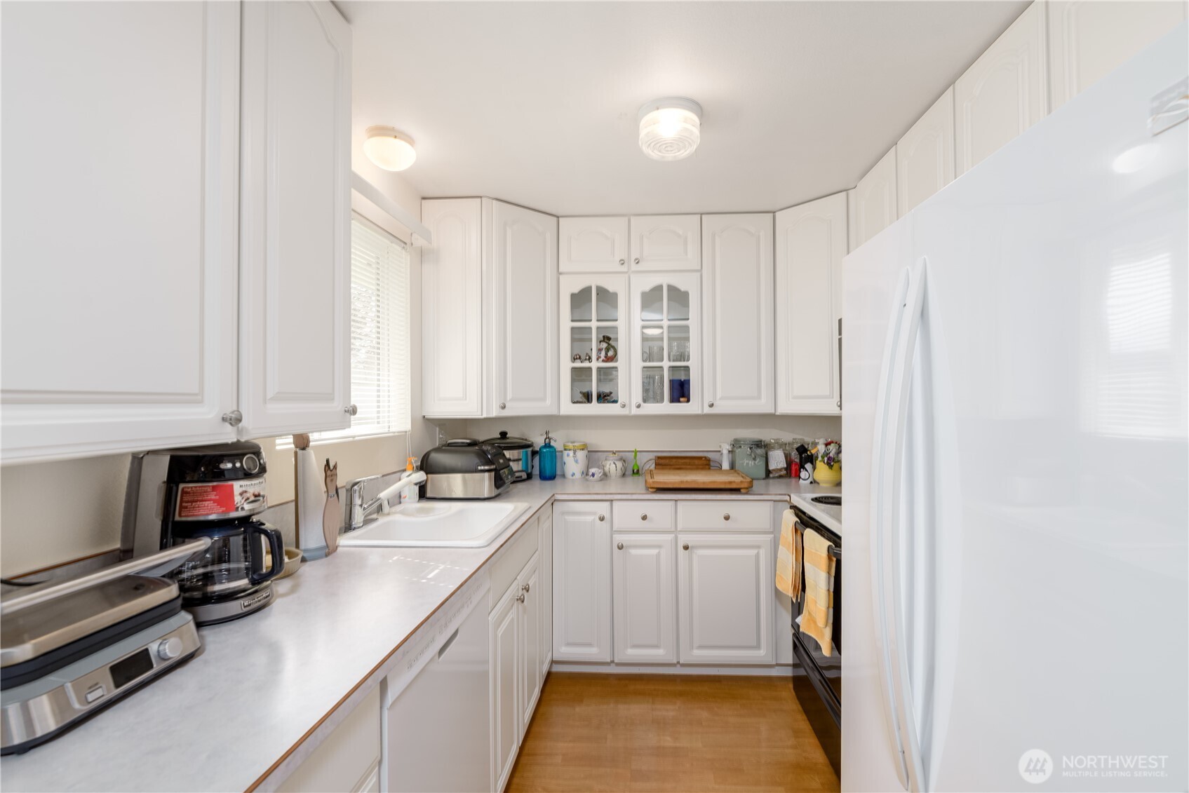 343 West Hemlock Street Sequim, WA 98382 - Photo 8 of 16 a view of a kitchen with a sink and cabinets