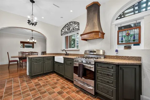 a kitchen with a stove and a microwave