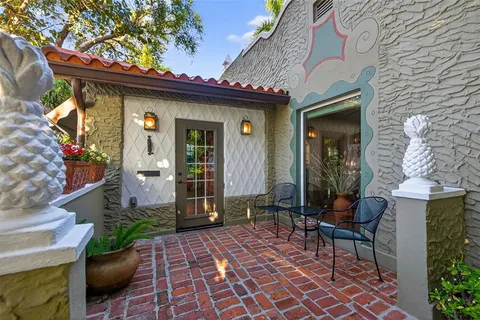 a view of a chairs and table in a patio