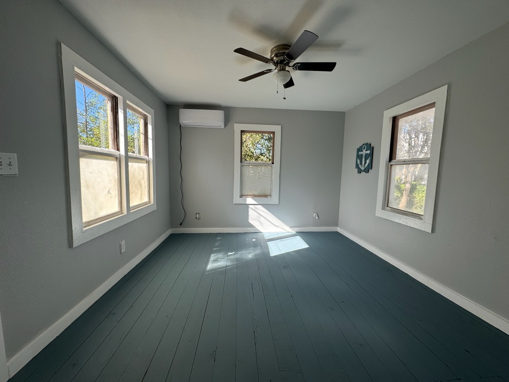 511 Main Street Martindale, TX 78655 - Photo 2 of 7 a view of an empty room with a window