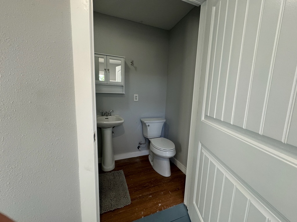 511 Main Street Martindale, TX 78655 - Photo 5 of 7 a bathroom with a toilet and a sink