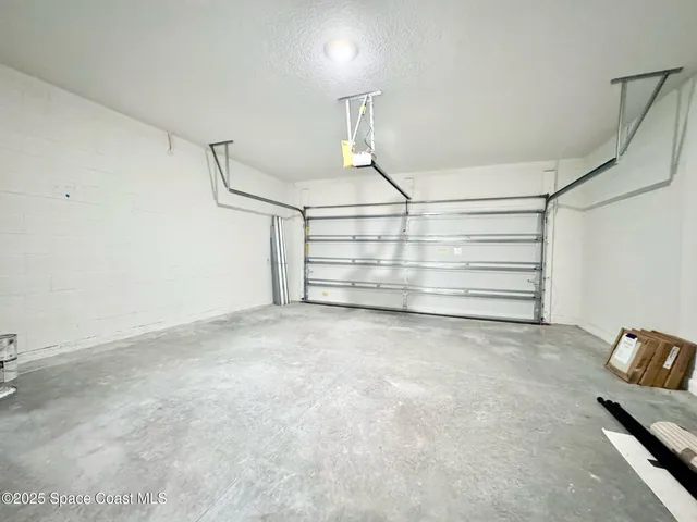 a view of an empty room with a white walls