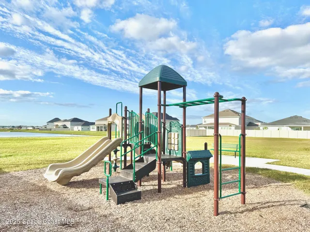 a view of a swimming pool with a lounge chairs