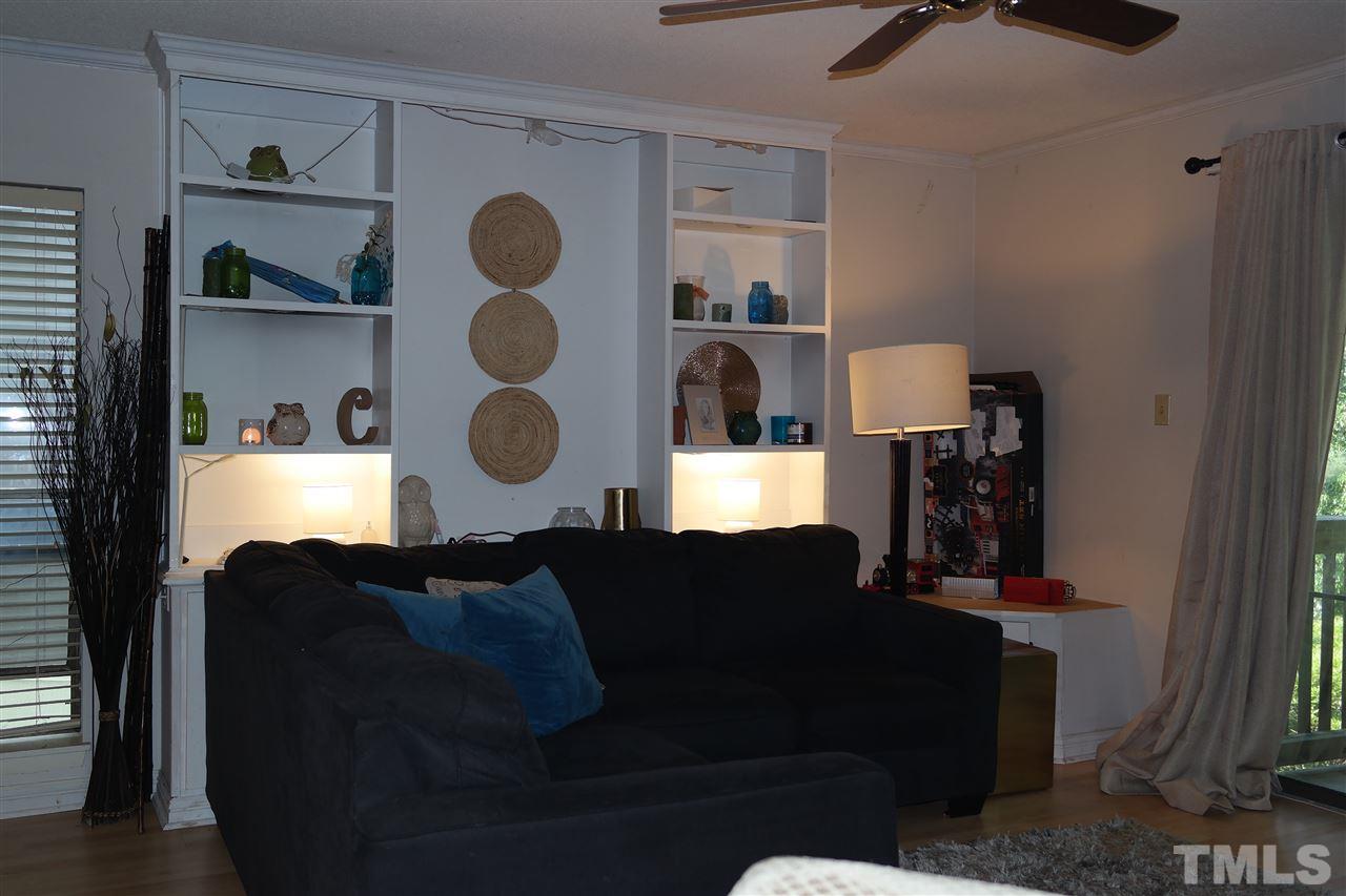 5108 Flint Ridge Place, Unit 5108 Raleigh, NC 27609 - Photo 12 of 15 a living room with furniture and wooden floor