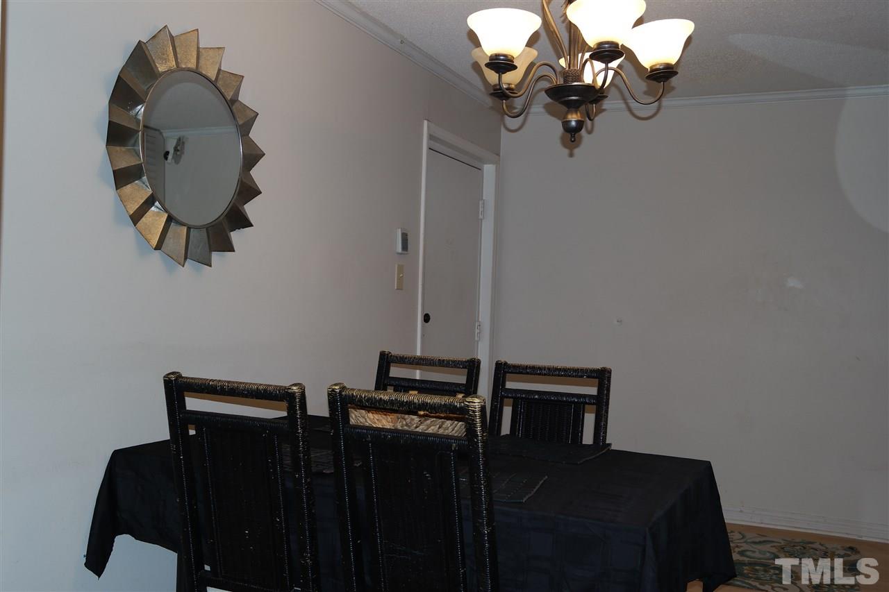 5108 Flint Ridge Place, Unit 5108 Raleigh, NC 27609 - Photo 8 of 15 a view of a mirror and a chandelier fan