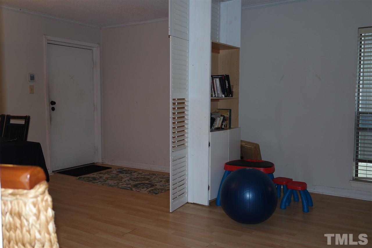 5108 Flint Ridge Place, Unit 5108 Raleigh, NC 27609 - Photo 10 of 15 an empty room with wooden floor and closet