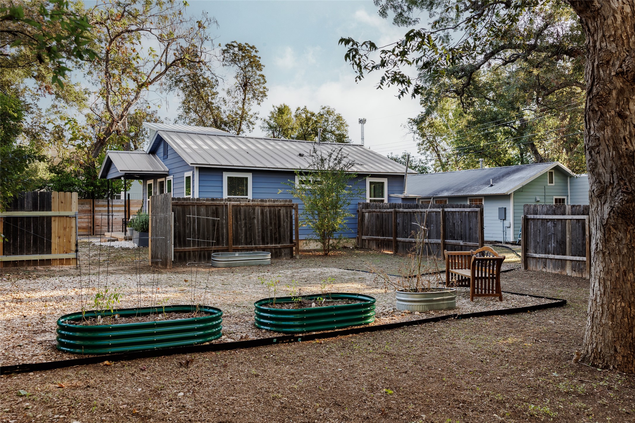 827 Gullett Street Austin, TX 78702 - Photo 23 of 25 a view of a house with backyard and sitting area