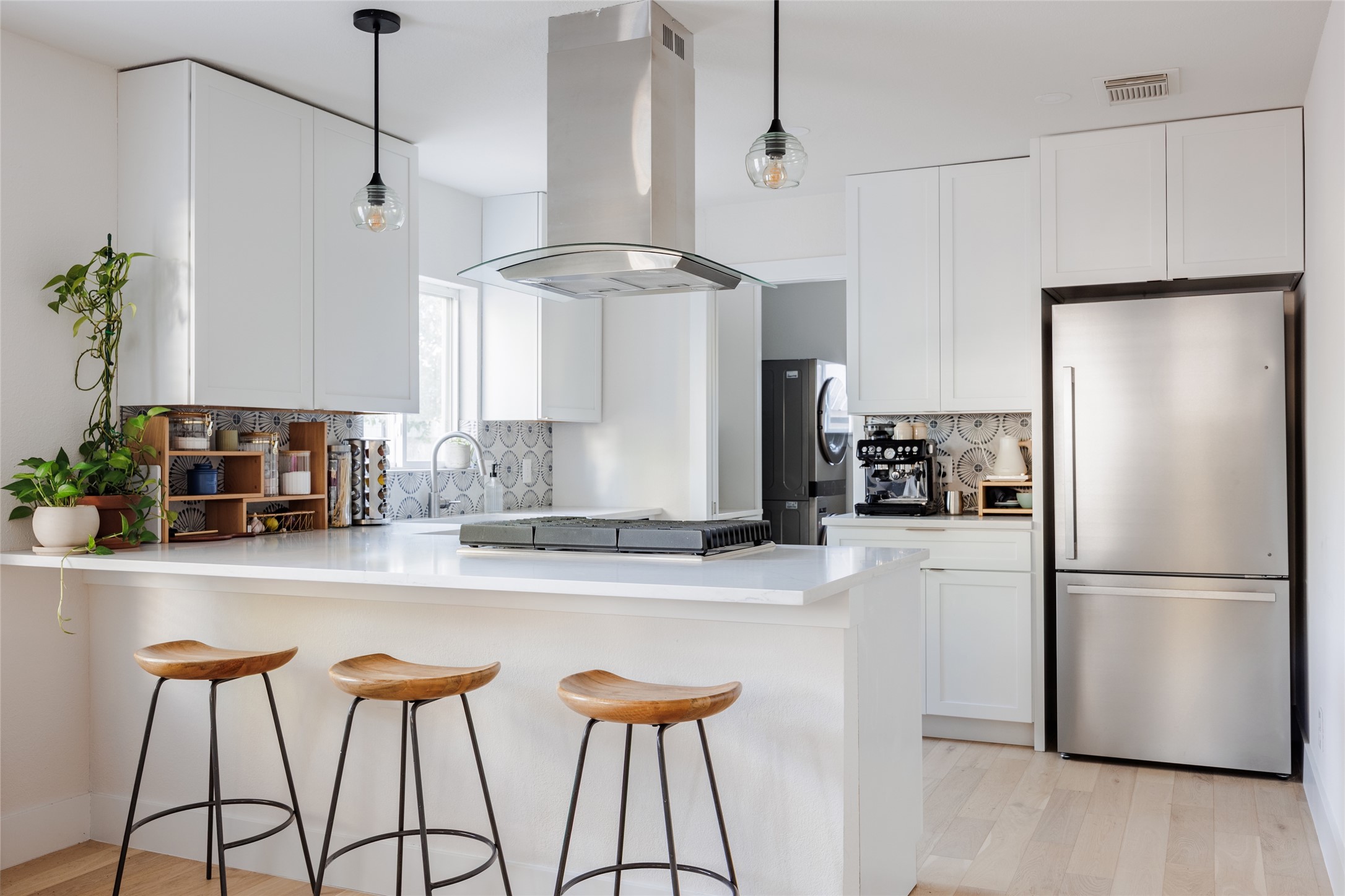 827 Gullett Street Austin, TX 78702 - Photo 6 of 25 a kitchen with stainless steel appliances granite countertop a refrigerator and a sink