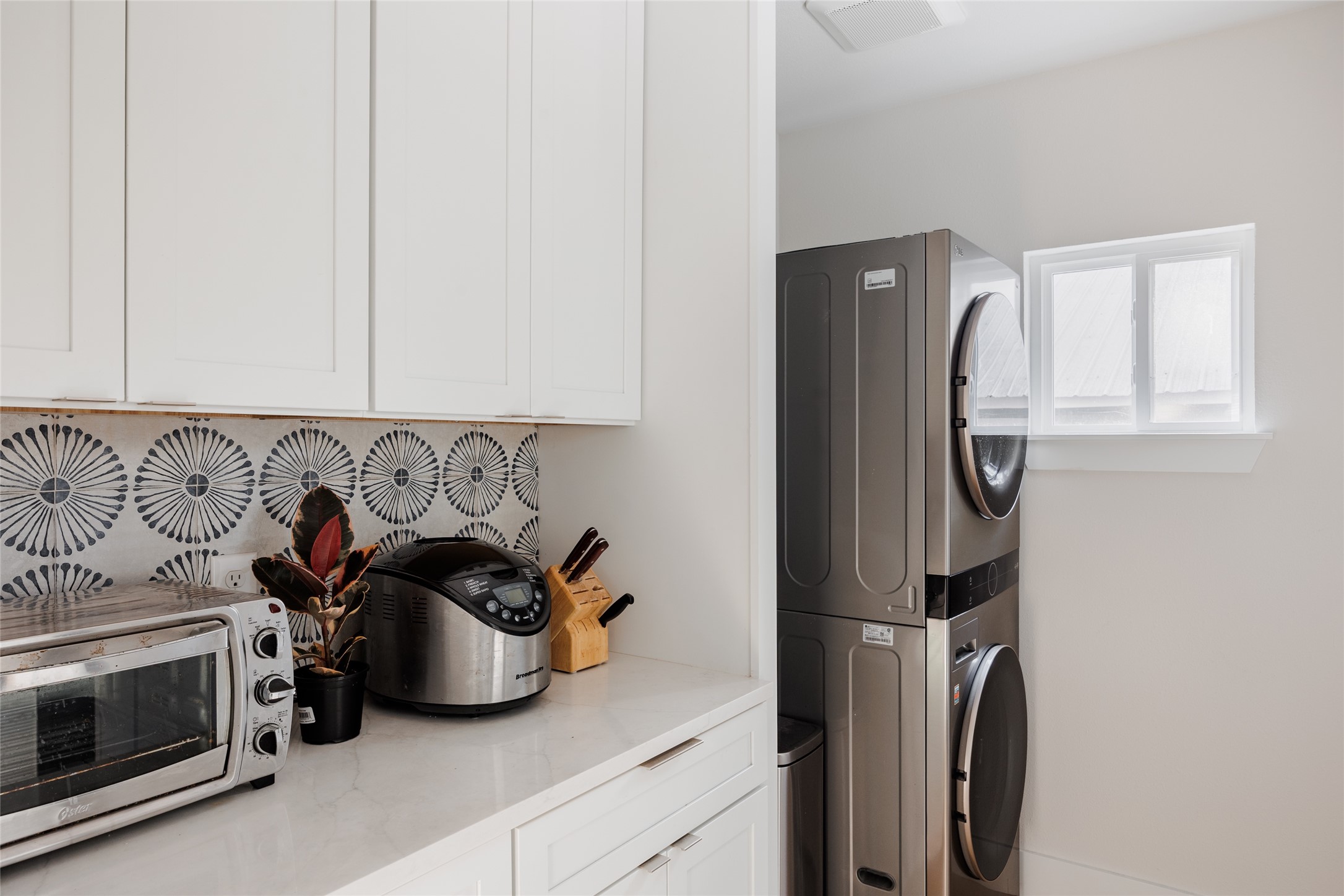 827 Gullett Street Austin, TX 78702 - Photo 9 of 25 a kitchen with a refrigerator and cabinets