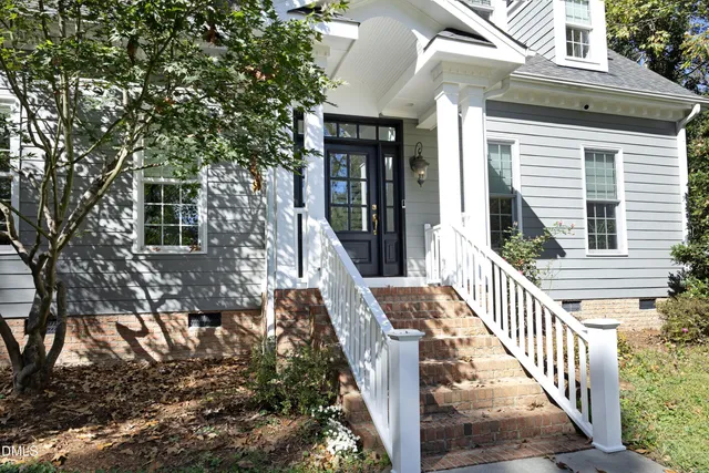 a view of a house with a small yard
