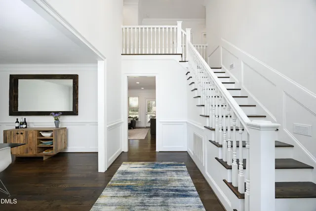 a view of an entryway with wooden floor