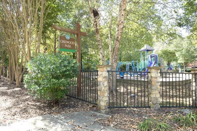 a view of a park with swings and slides