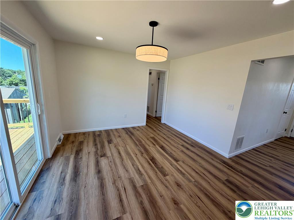 3508 Nazareth Road Easton, PA 18045 - Photo 17 of 25 Seamless flooring extends through this room with a sliding glass door opening to an outdoor deck.