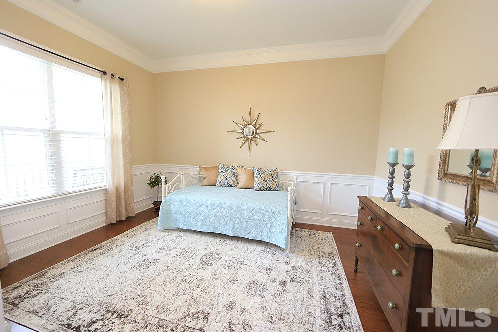 8448 Lentic Court Raleigh, NC 27615 - Photo 18 of 25 Can be used as a third bedroom or flex space. Upgraded with privacy doors and custom built closet.