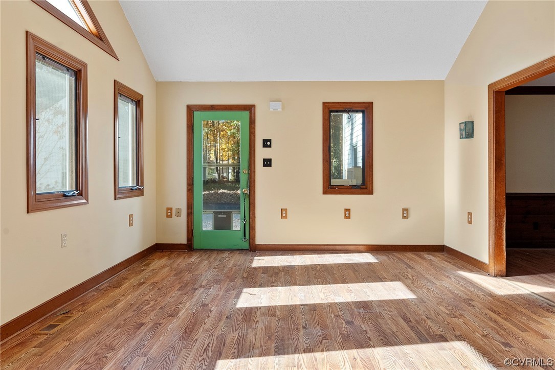 3319 Ludgate Road Chester, VA 23831 - Photo 18 of 47 a view of an empty room with wooden floor and a window