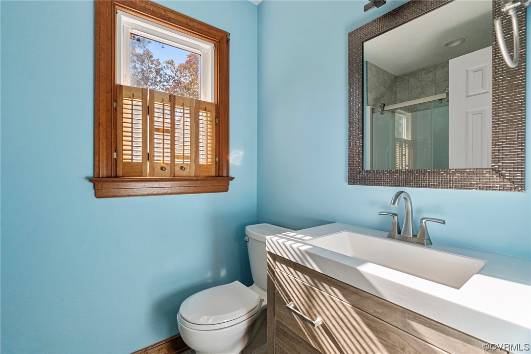3319 Ludgate Road Chester, VA 23831 - Photo 30 of 47 a bathroom with a toilet a sink and a mirror